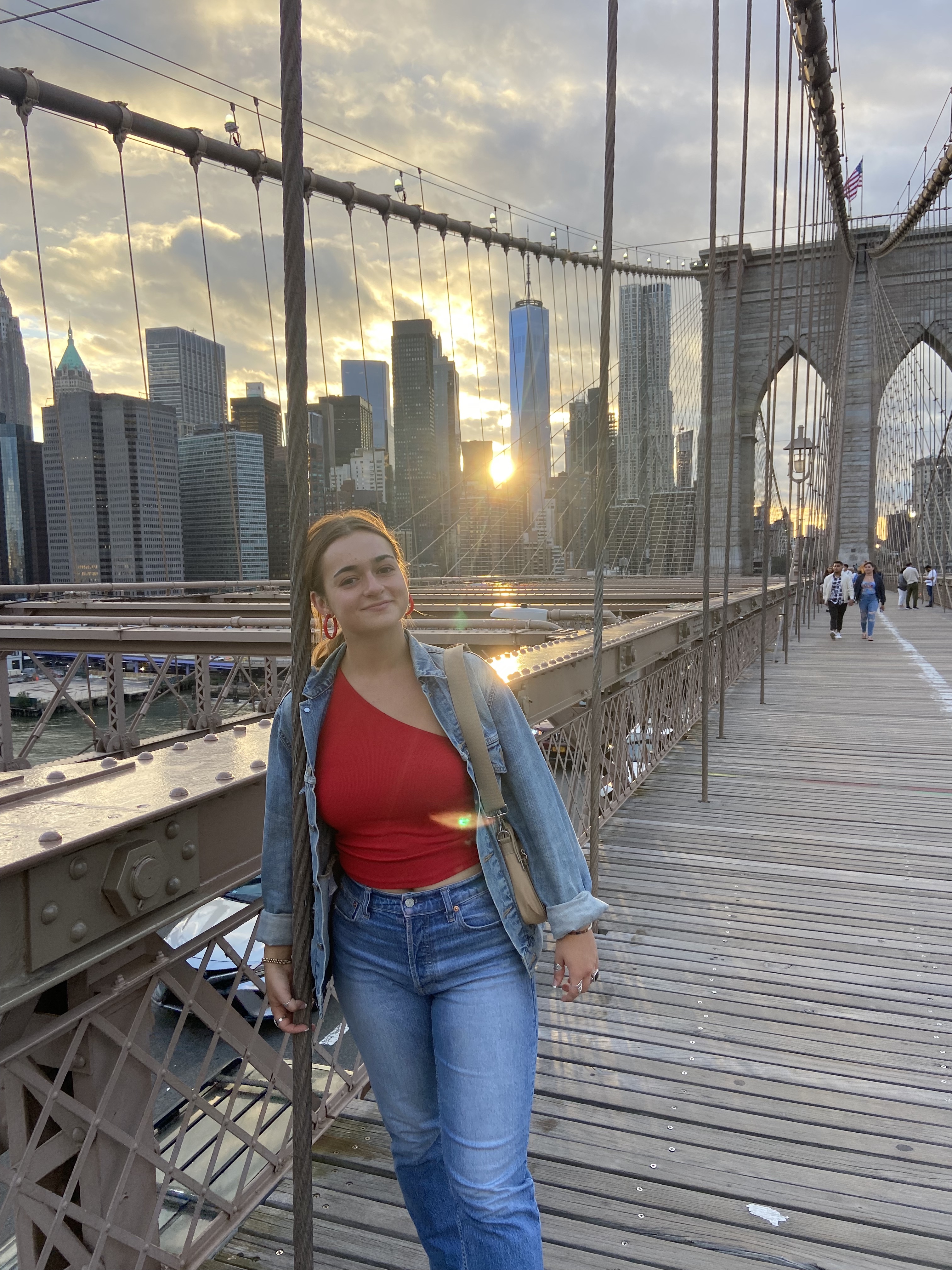 Emily walking across the Brooklyn Bridge.